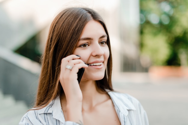 Smiling woman talks on the phone