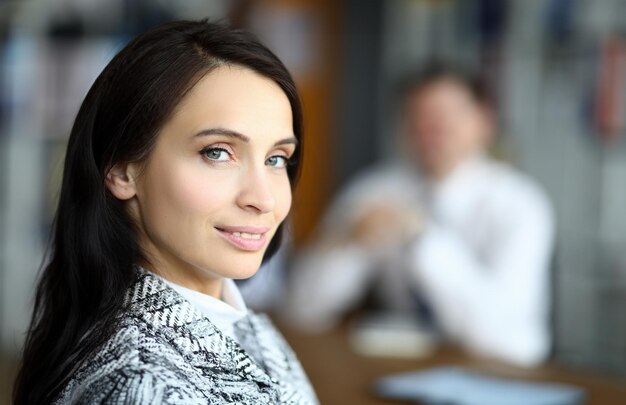 Smiling woman turned around in front her man