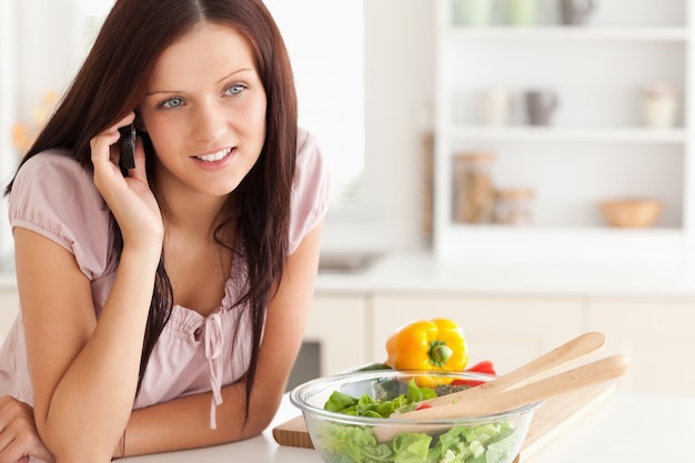 Smiling woman using a cellphone