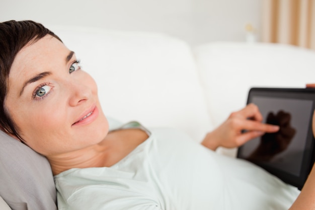 Smiling woman using a tablet computer