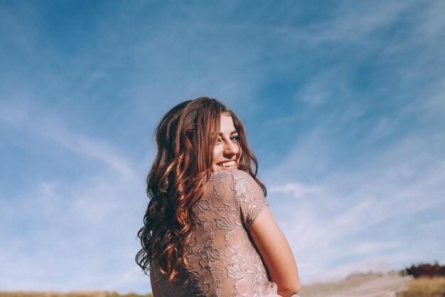 Smiling woman walking on mountains