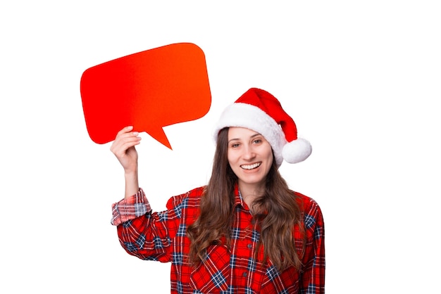 Smiling woman wearing a Christmas hat is holding a bubble speech.