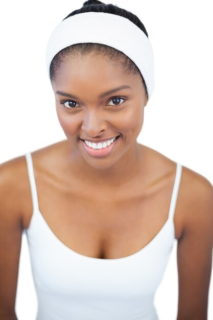 Smiling woman wearing white headband 