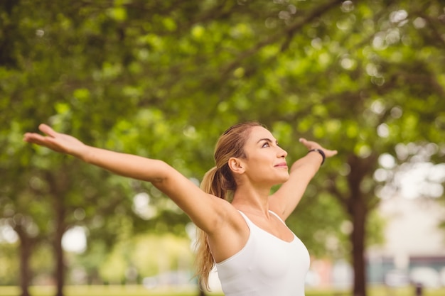 Smiling woman with arms outstretched 