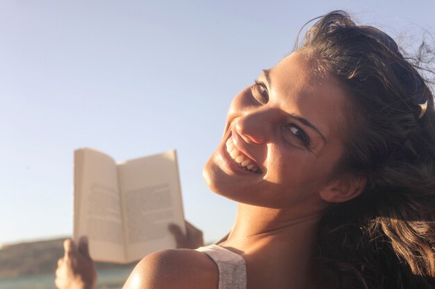 smiling woman with a  book