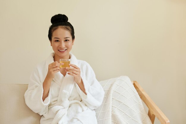 Smiling Woman With Cup of Tea