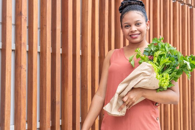 Smiling Woman with Fresh Greens