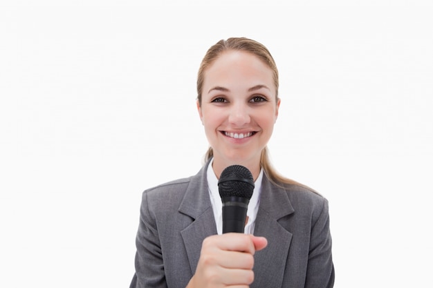 Smiling woman with microphone