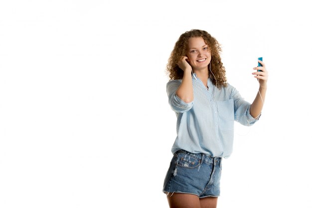 Smiling woman with a music player