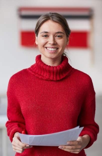 Smiling woman with papers