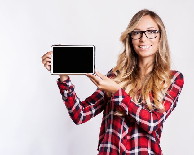 Smiling woman with tablet computer