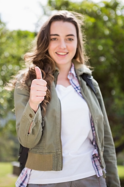 Smiling woman with thumbs up