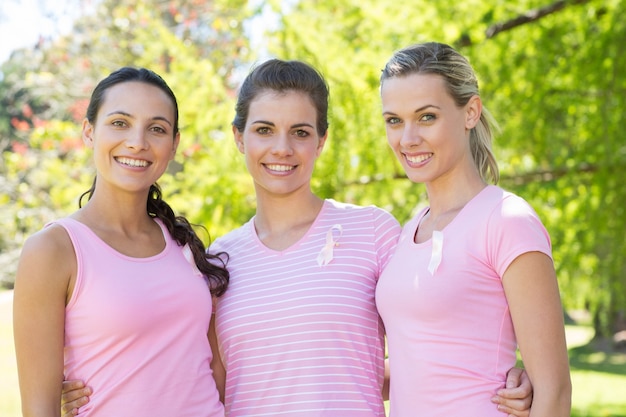 Smiling women in pink for breast cancer awareness