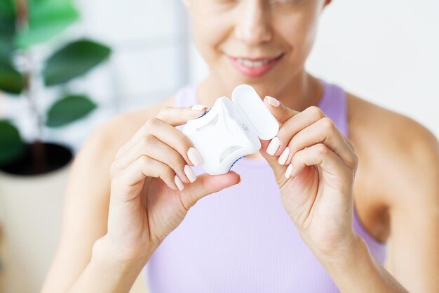 Smiling women use dental floss white healthy teeth