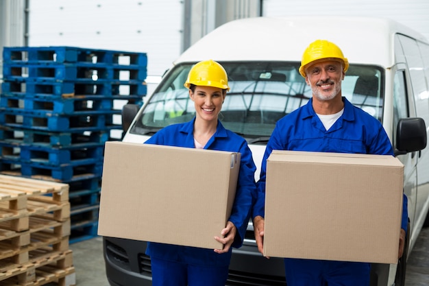 Smiling workers looking at camera