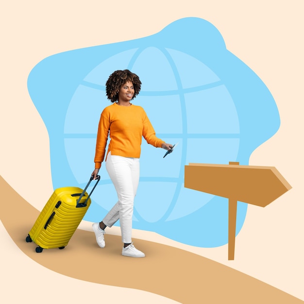 Фото Улыбающаяся молодая африканская туристка с чемоданом, идущая по дороге со знаком земного шара