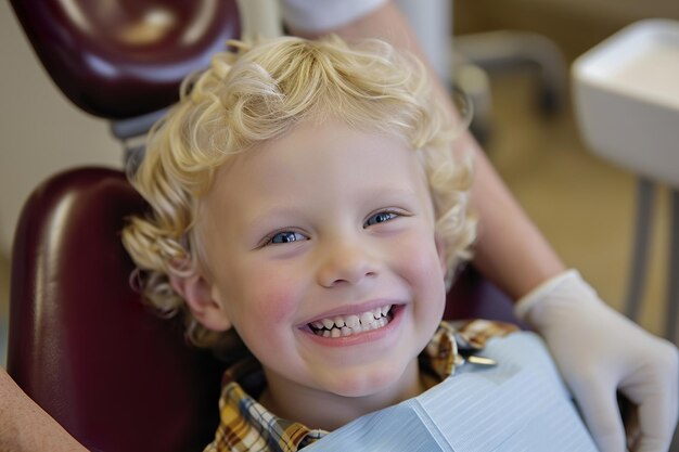 Photo a smiling young blond boy in a dental chair examination by a dentist