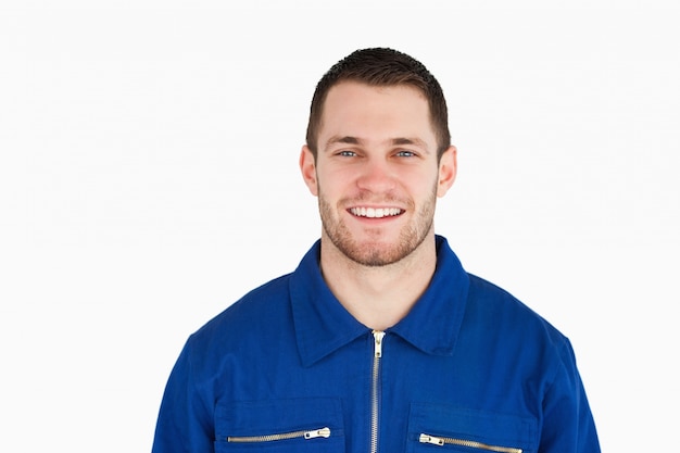 Smiling young blue collar worker