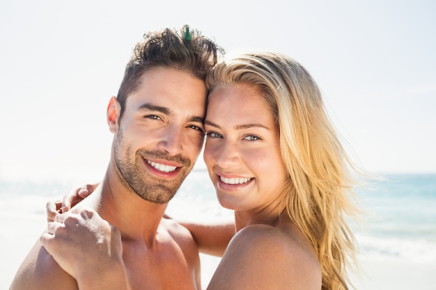 Smiling young couple hugging 