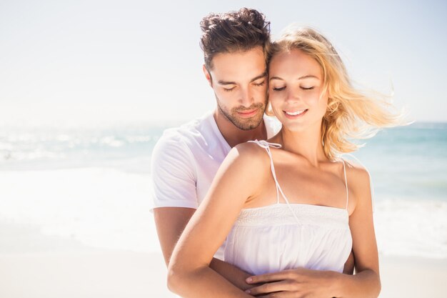 Smiling young couple hugging 