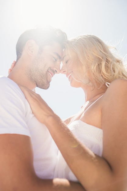 Smiling young couple hugging 