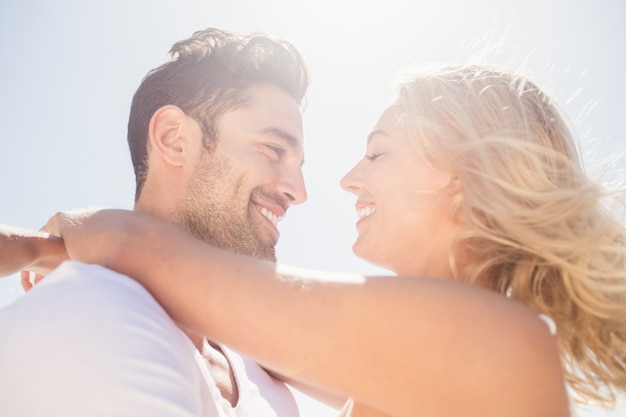 Smiling young couple hugging 