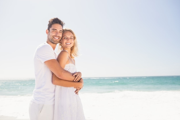 Smiling young couple hugging 