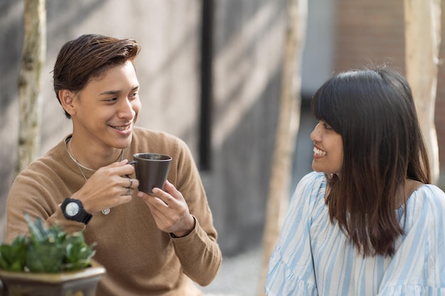 smiling young couple looking face to face