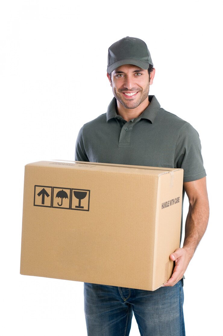 Smiling young delivery man holding and carrying a cardbox isolated on white background
