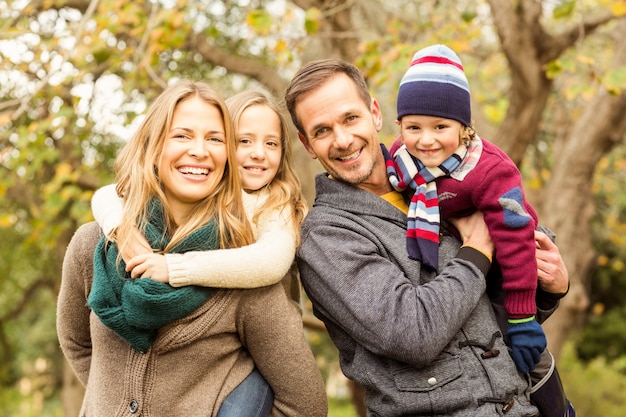 Smiling young family posing together