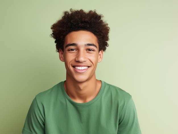 Smiling young man of Mexican descent against neutral background