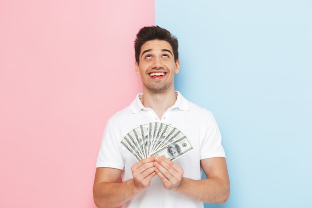 Smiling young man standing isolated