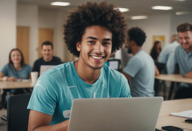 Smiling young man using laptop in office energetic and productive ambiance with teamwork