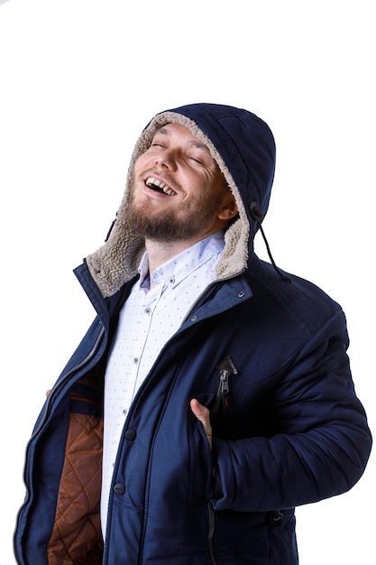 Smiling young man in winter warm coat