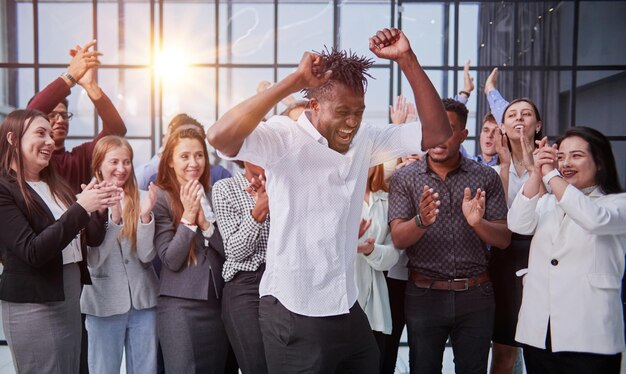 Photo smiling young multiracial workers staff group pose together as human resource