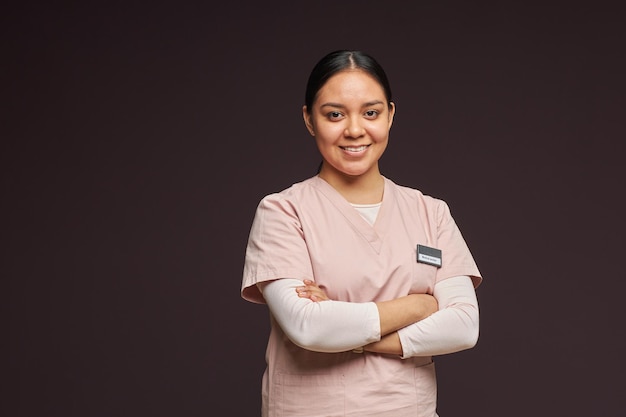 Smiling young social worker in uniform