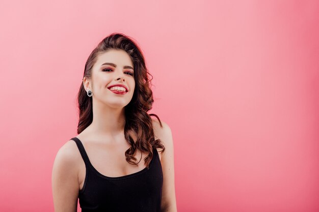 Smiling young woman in black clothes