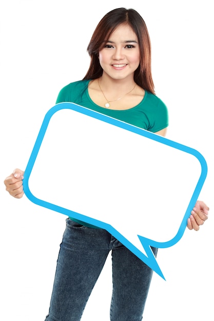 Smiling young woman holding blank text bubble in specs