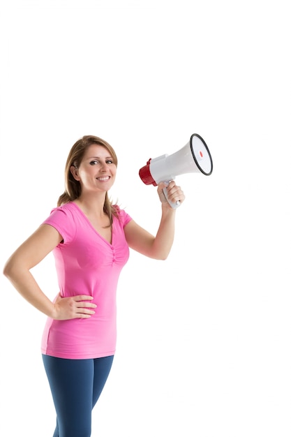 Smiling young woman holding bullhorn