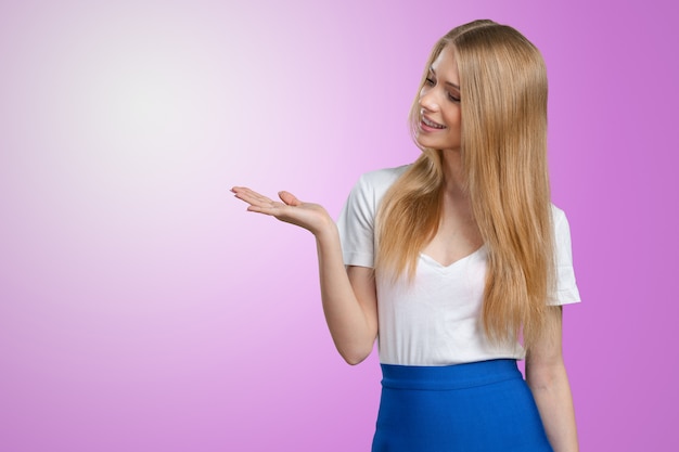 Smiling young woman holding something