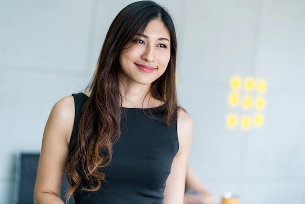 Smiling young woman looking away