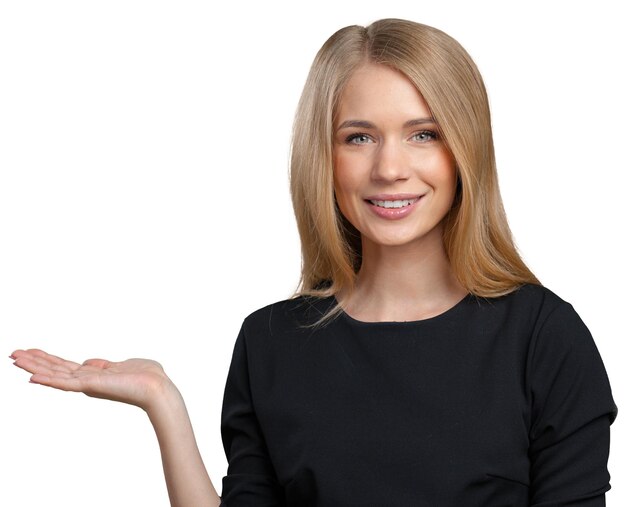 Smiling young woman pointing