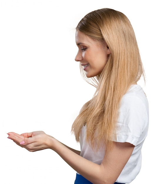 Smiling young woman pointing