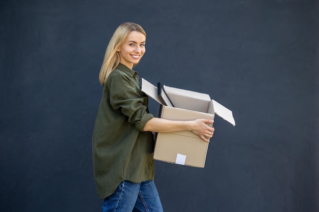 smiling young woman preparing for relocation