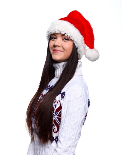 Smiling young woman in red christmass hat at white background