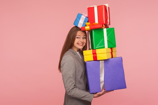 Photo smiling young woman standing against multi colored background