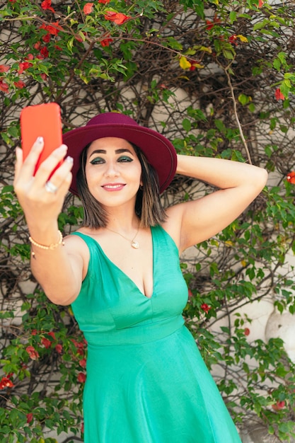 Smiling Young Woman Talking On Her Smart Phone.