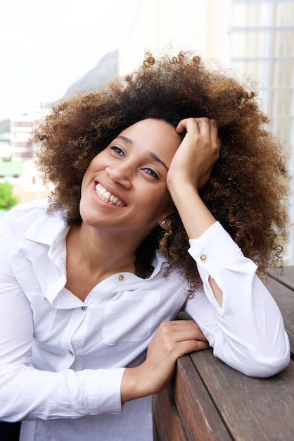 Smiling young woman thinking and looking up