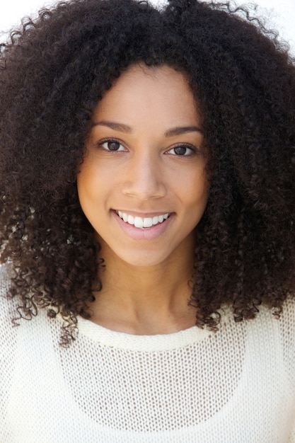 Smiling young woman with curly hair