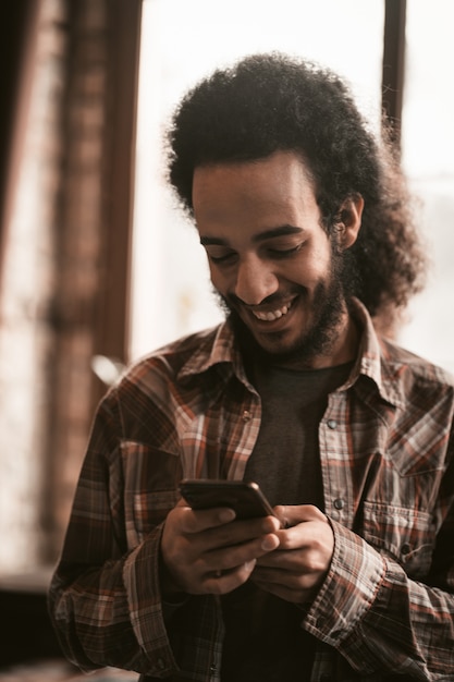 Smilling Guy Chatting On Smartphone